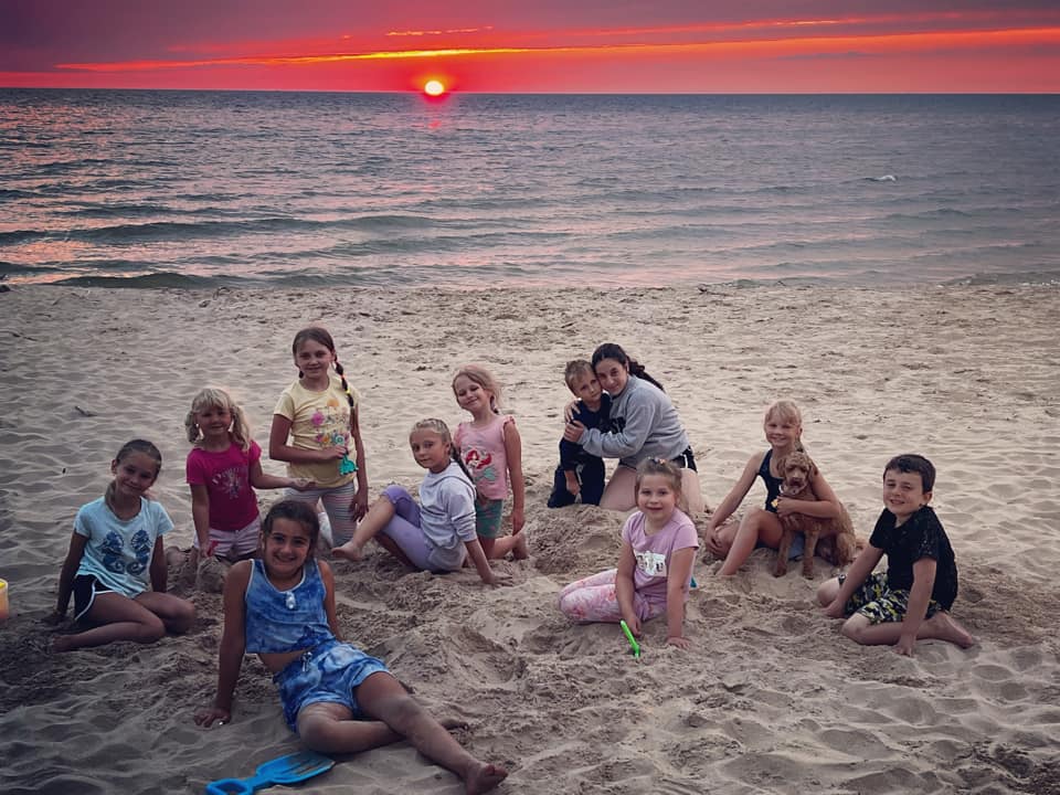 kids on the beach at sunset