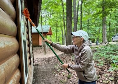 worker cleaning the outside of a cabin window
